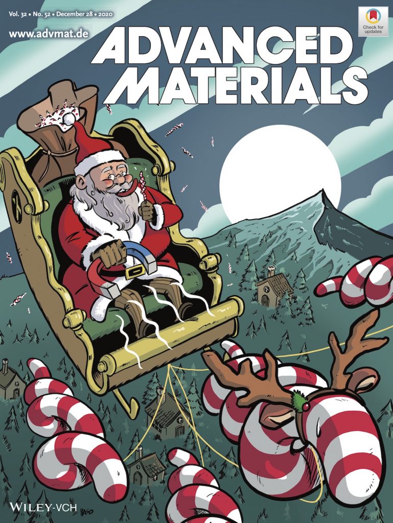 Journal cover art for Advanced Materials. The cover features a cartoon representation of Santa Claus in a sleigh, flying over a forested mountain scene, carrying a sack of spiral candy canes. The sleigh is pulled by larger red and white spiral-shaped candy canes, in place of reindeer, with the leader wearing reindeer antlers. These candy canes are attracting a magnet held in Santa’s hand.