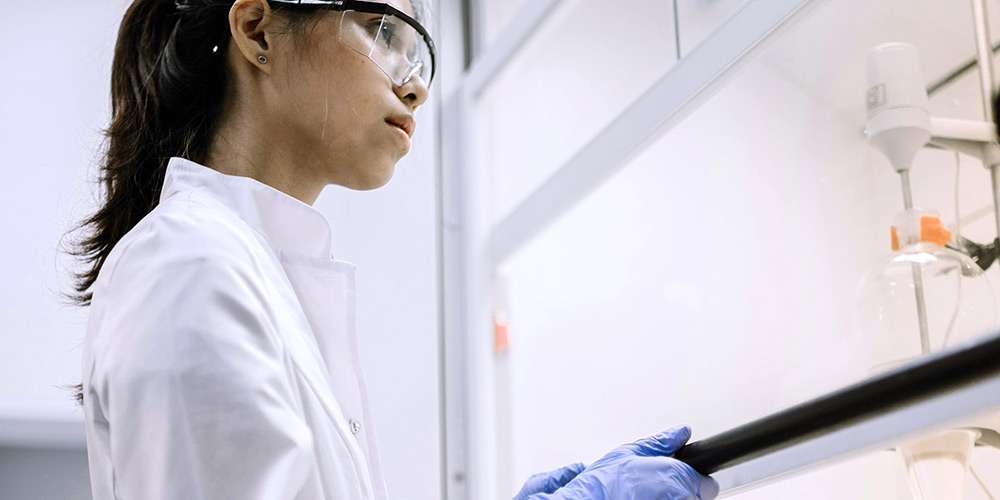 Researcher working in a biosafety cabinet