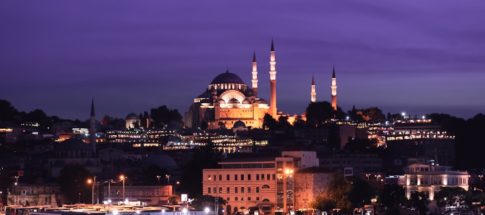 ship on dock near building at night